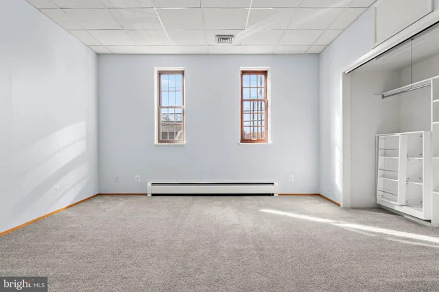 an empty room with windows