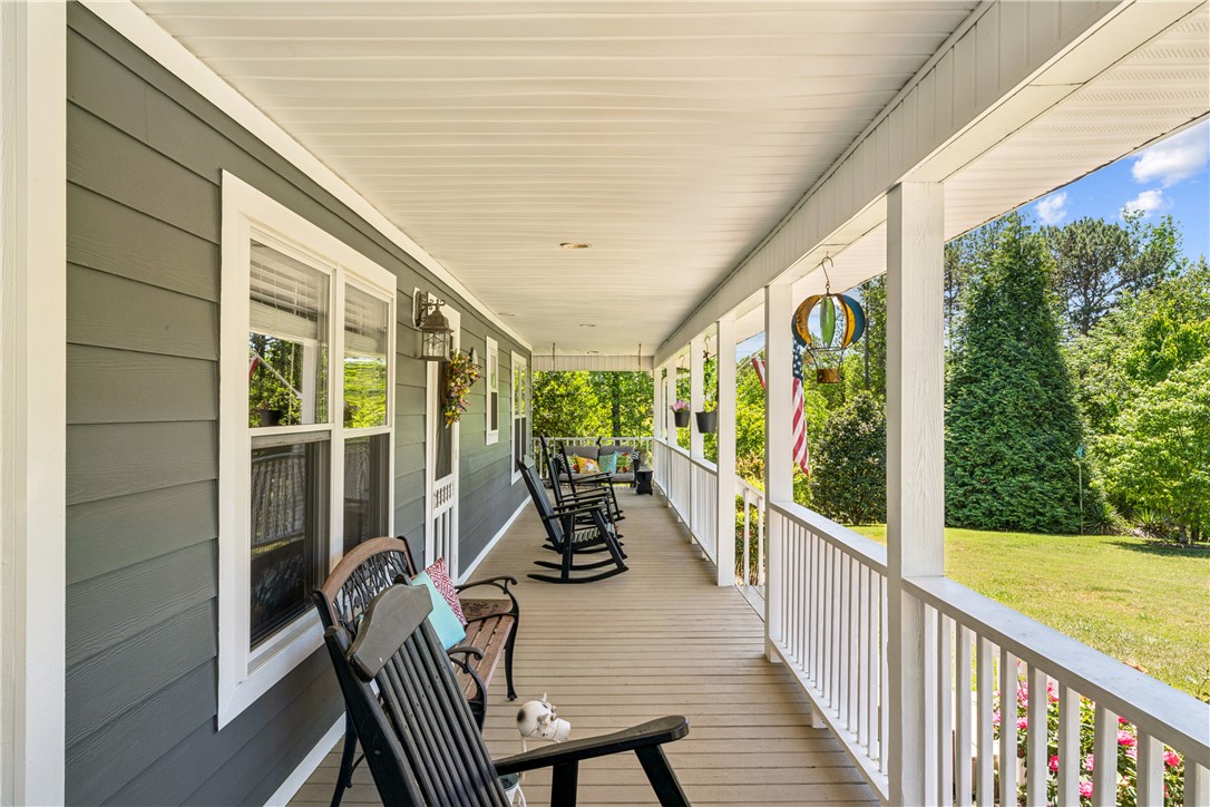 189 Little Choestoea Road Westminster, SC 29693 - Photo 29 of 38 This inviting porch offers tranquil views, ideal for quiet mornings or relaxing evenings.