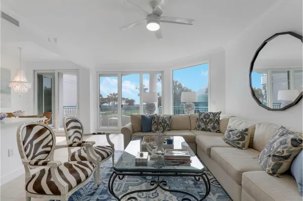 a living room with furniture and a large mirror