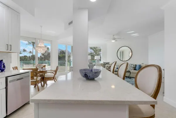 a view of dining room furniture and a large window