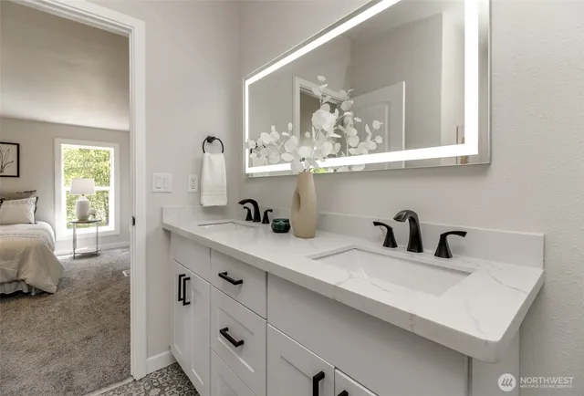 a bathroom with a sink and a mirror