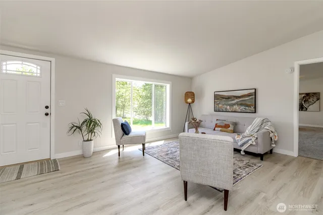 a living room with furniture and a window
