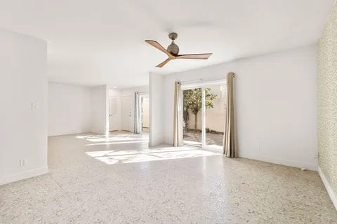 a bedroom with two beds and a chandelier
