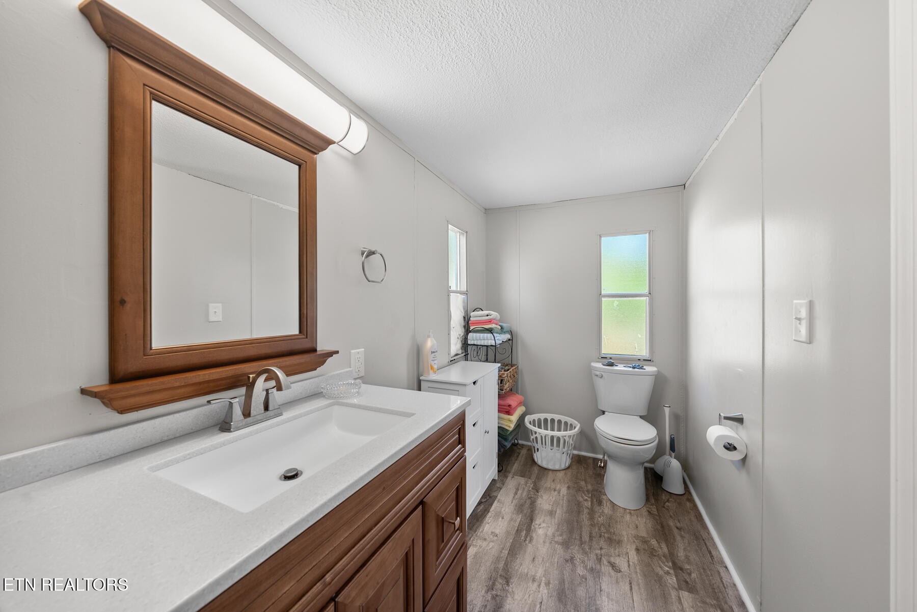390 Sparkman Town Road Rock Island, TN 38581 - Photo 16 of 33 a bathroom with a double vanity sink toilet and shower
