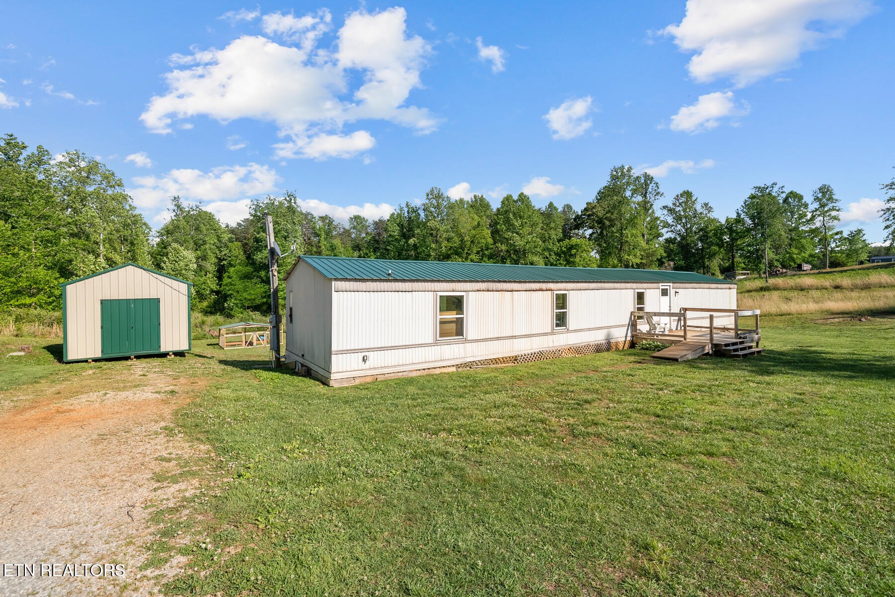 390 Sparkman Town Road Rock Island, TN 38581 - Photo 2 of 33 a house with river in front of it