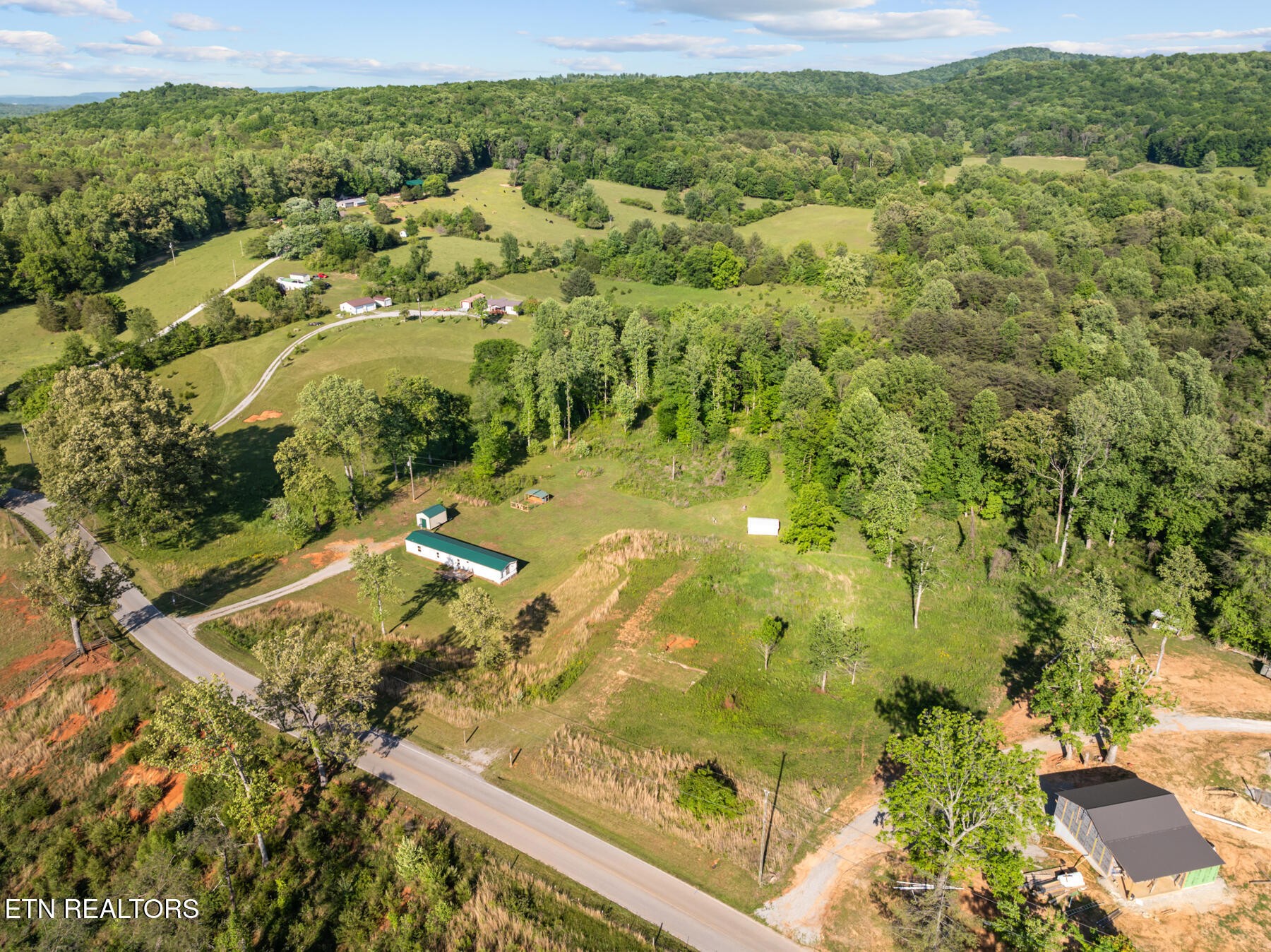 390 Sparkman Town Road Rock Island, TN 38581 - Photo 27 of 33 a view of a lake with a yard