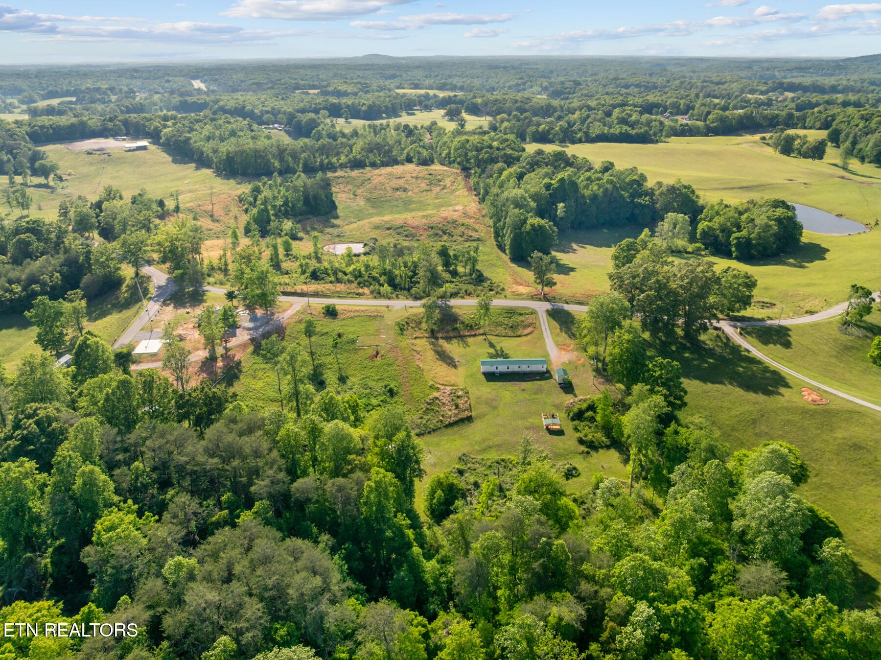 390 Sparkman Town Road Rock Island, TN 38581 - Photo 31 of 33 an aerial view of residential houses with outdoor space and river