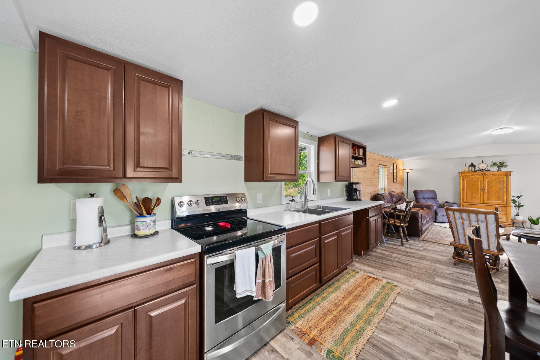 390 Sparkman Town Road Rock Island, TN 38581 - Photo 8 of 33 a kitchen with stainless steel appliances granite countertop a sink stove and cabinets