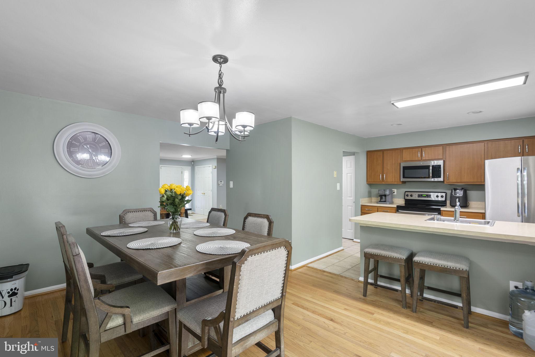 15048 Shamrock Ridge Road Silver Spring, MD 20906 - Photo 5 of 34 Modern kitchen and dining area blend.