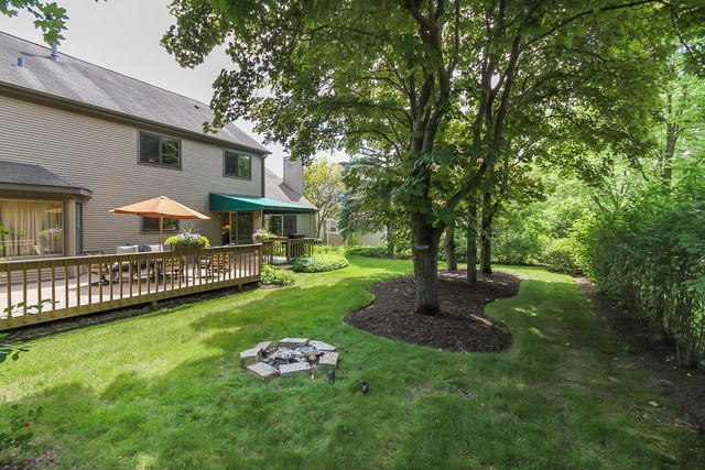 650 Raintree Court Buffalo Grove, IL 60089 - Photo 24 of 25 a view of a house with a yard and a garden