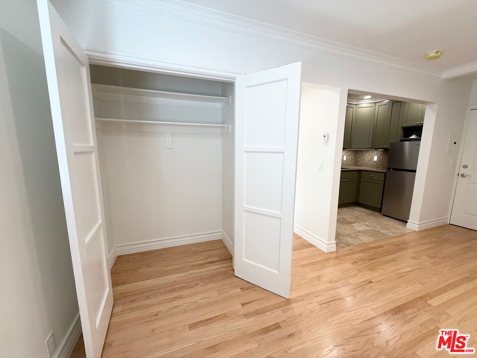 204 South Reeves Drive Beverly Hills, CA 90212 - Photo 4 of 10 a view of empty room with wooden floor