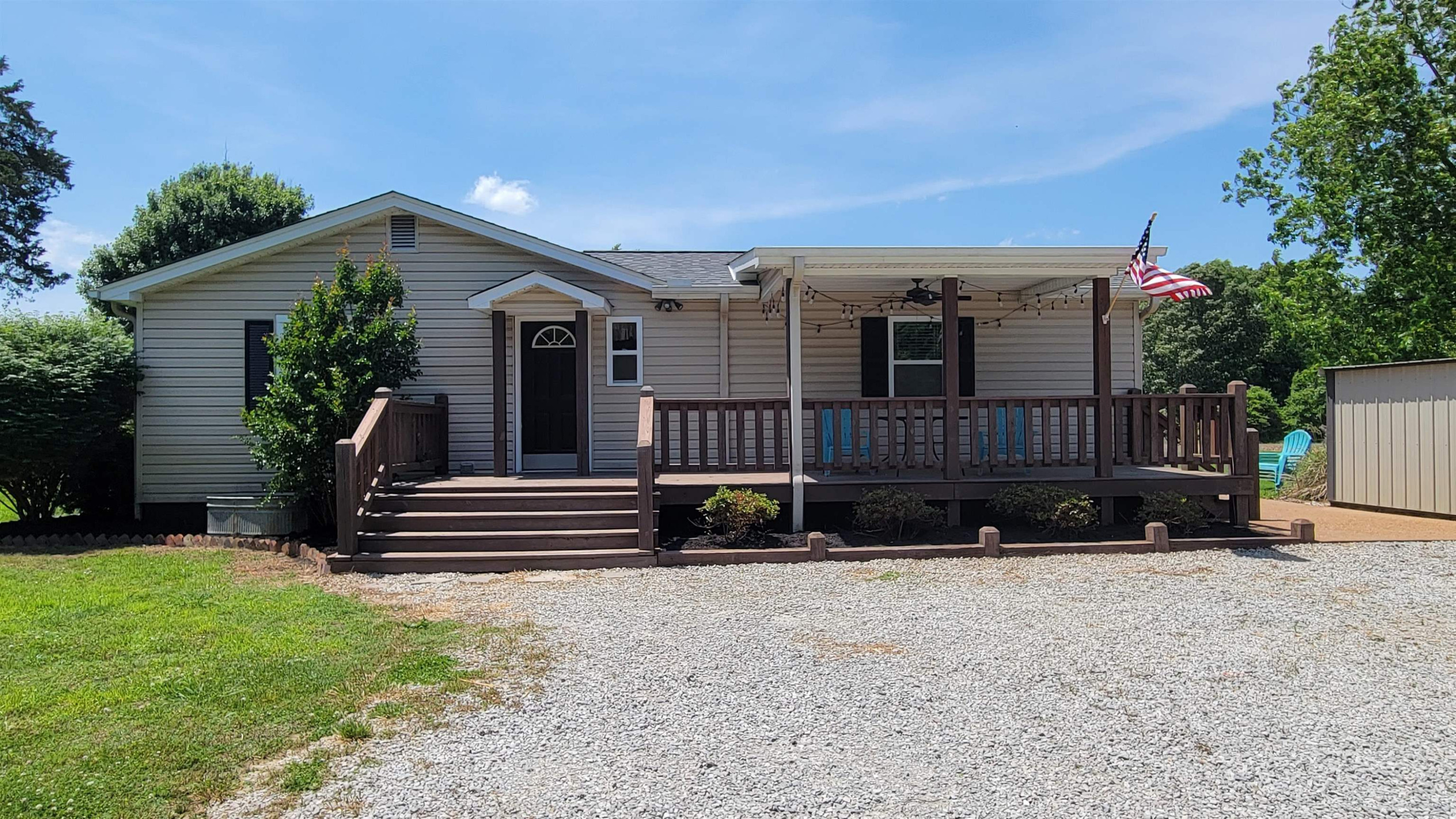 183 Spring Creek Law Road Jackson, TN 38305 - Photo 2 of 42 a view of house with backyard and a garden
