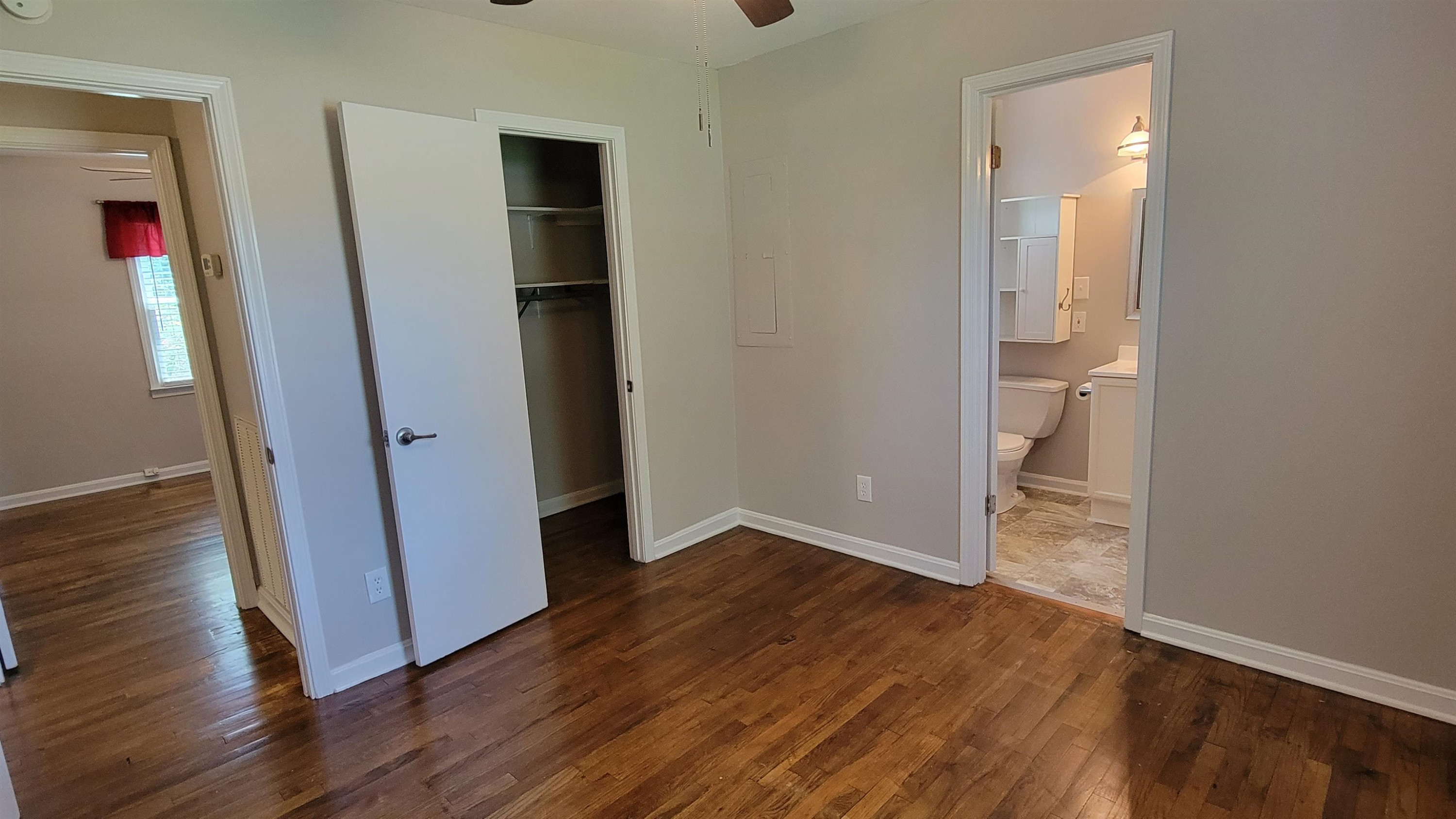 183 Spring Creek Law Road Jackson, TN 38305 - Photo 25 of 42 an empty room with wooden floor and closet