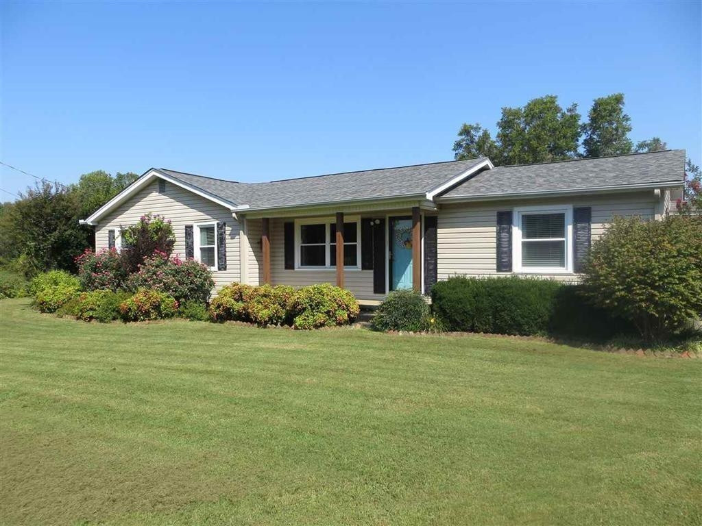 183 Spring Creek Law Road Jackson, TN 38305 - Photo 3 of 42 a front view of a house with a yard