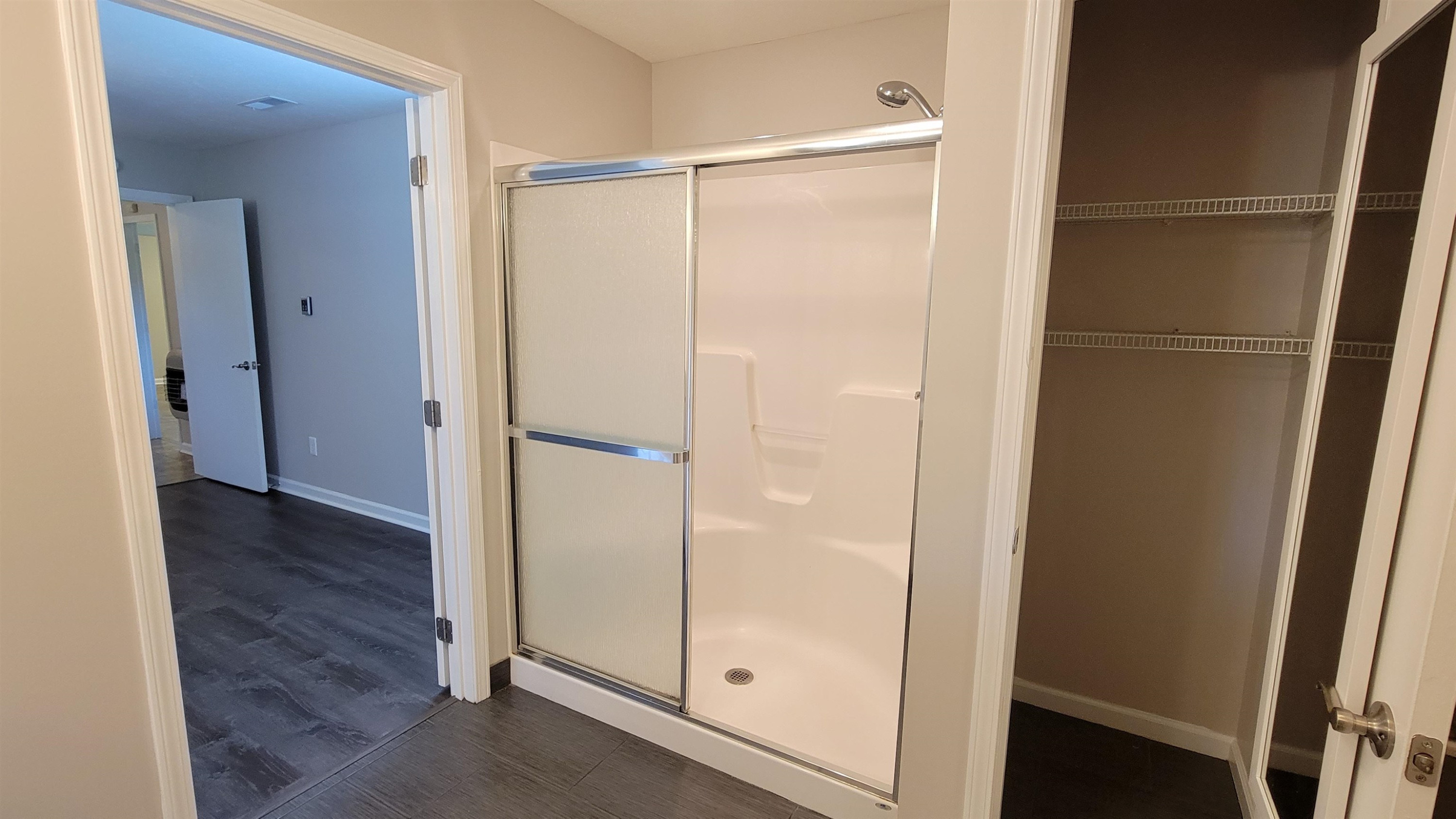 183 Spring Creek Law Road Jackson, TN 38305 - Photo 33 of 42 a bathroom with a glass shower door