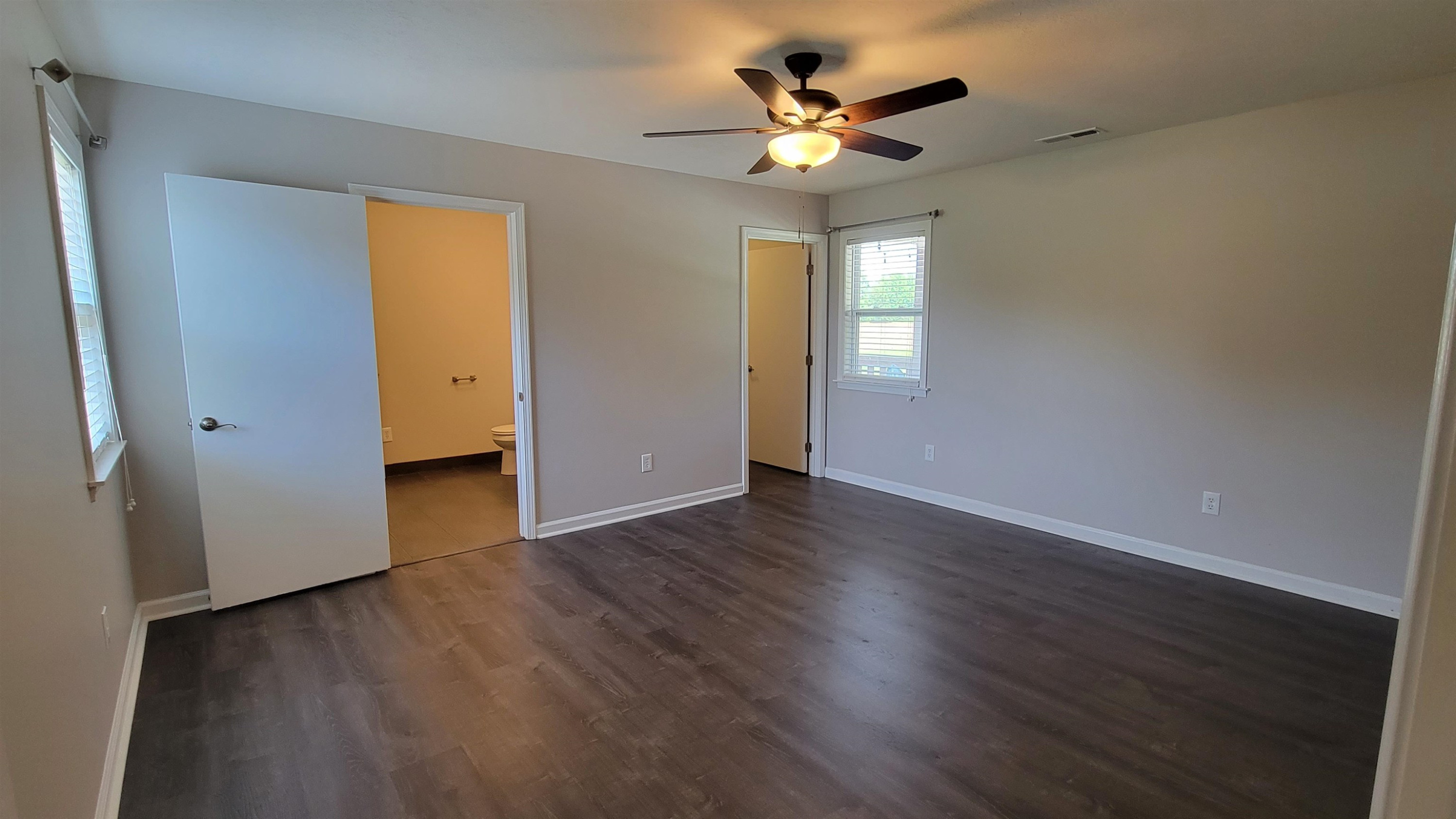183 Spring Creek Law Road Jackson, TN 38305 - Photo 35 of 42 a view of an empty room with wooden floor and a window