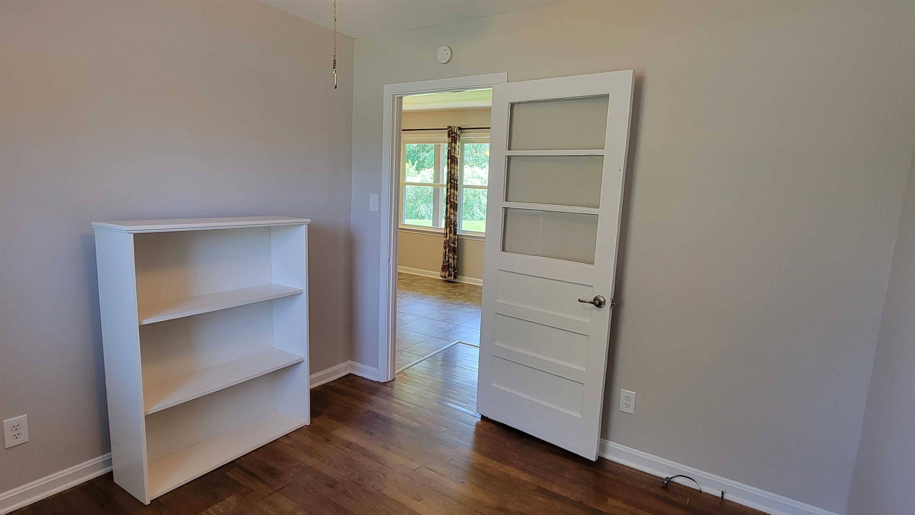183 Spring Creek Law Road Jackson, TN 38305 - Photo 37 of 42 a view of walk in closet with empty racks