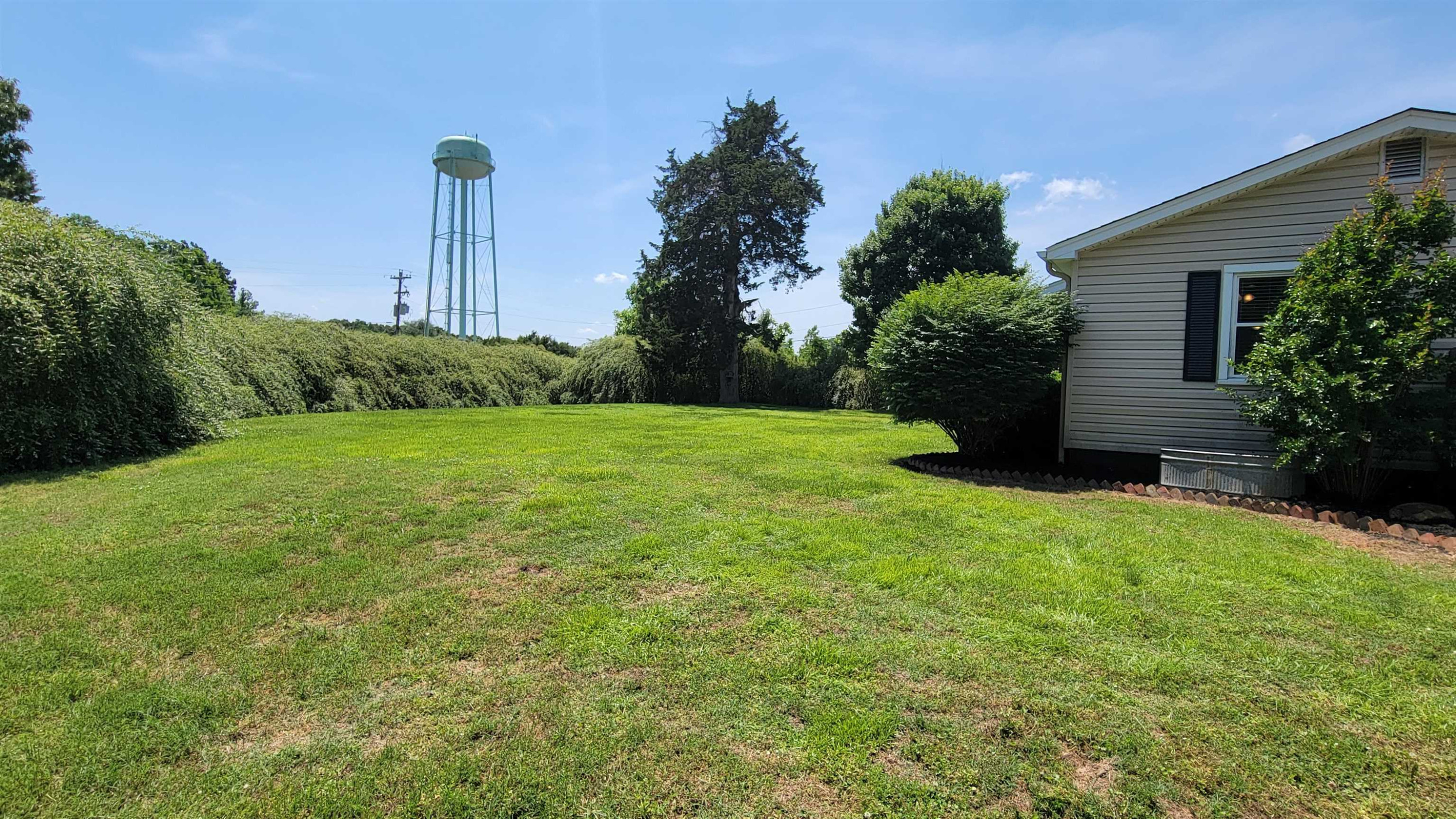 183 Spring Creek Law Road Jackson, TN 38305 - Photo 42 of 42 a view of a house with a yard and plant