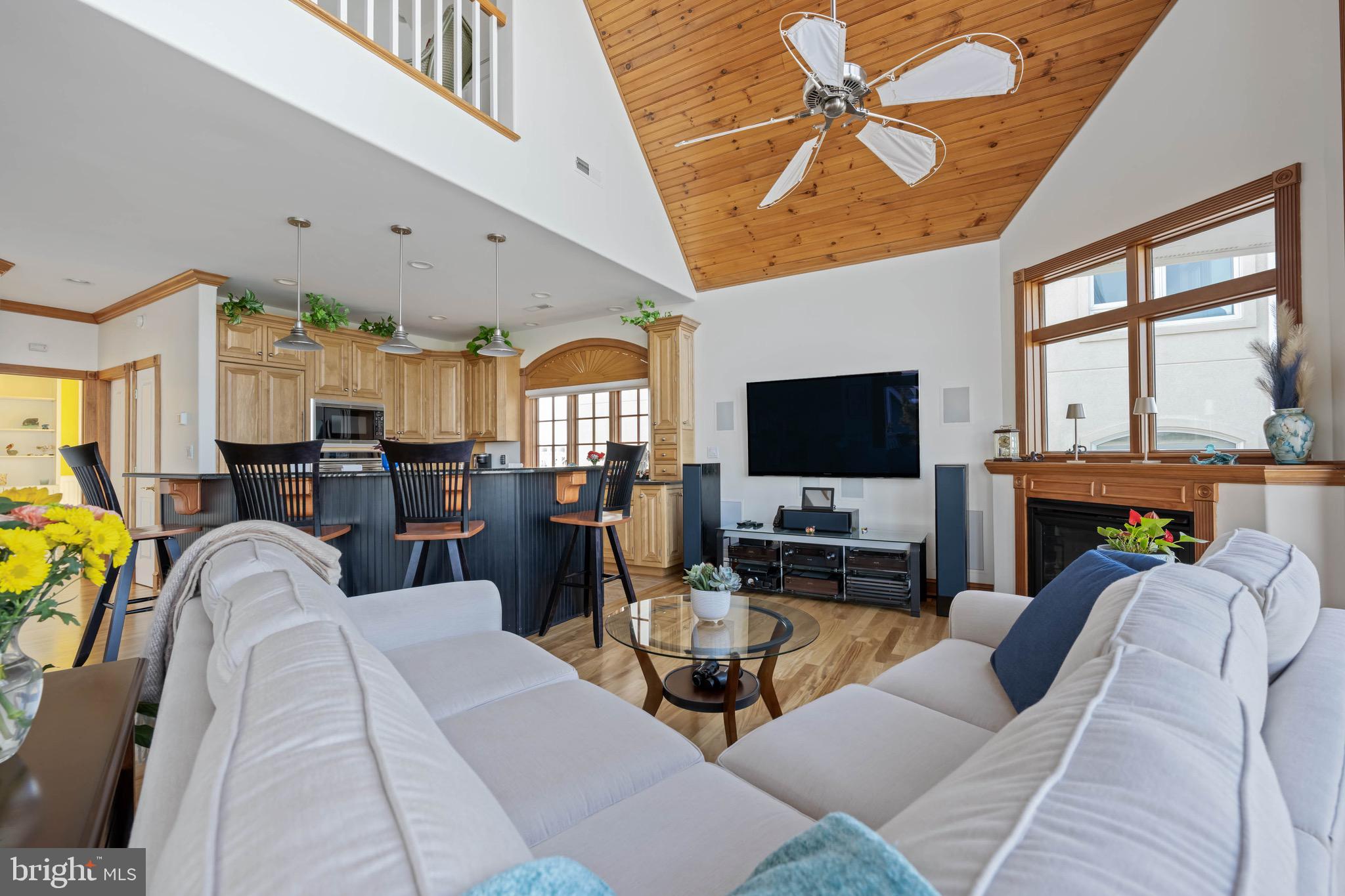 12959 Harbor Road Ocean City, MD 21842 - Photo 11 of 85 a living room with furniture and a flat screen tv