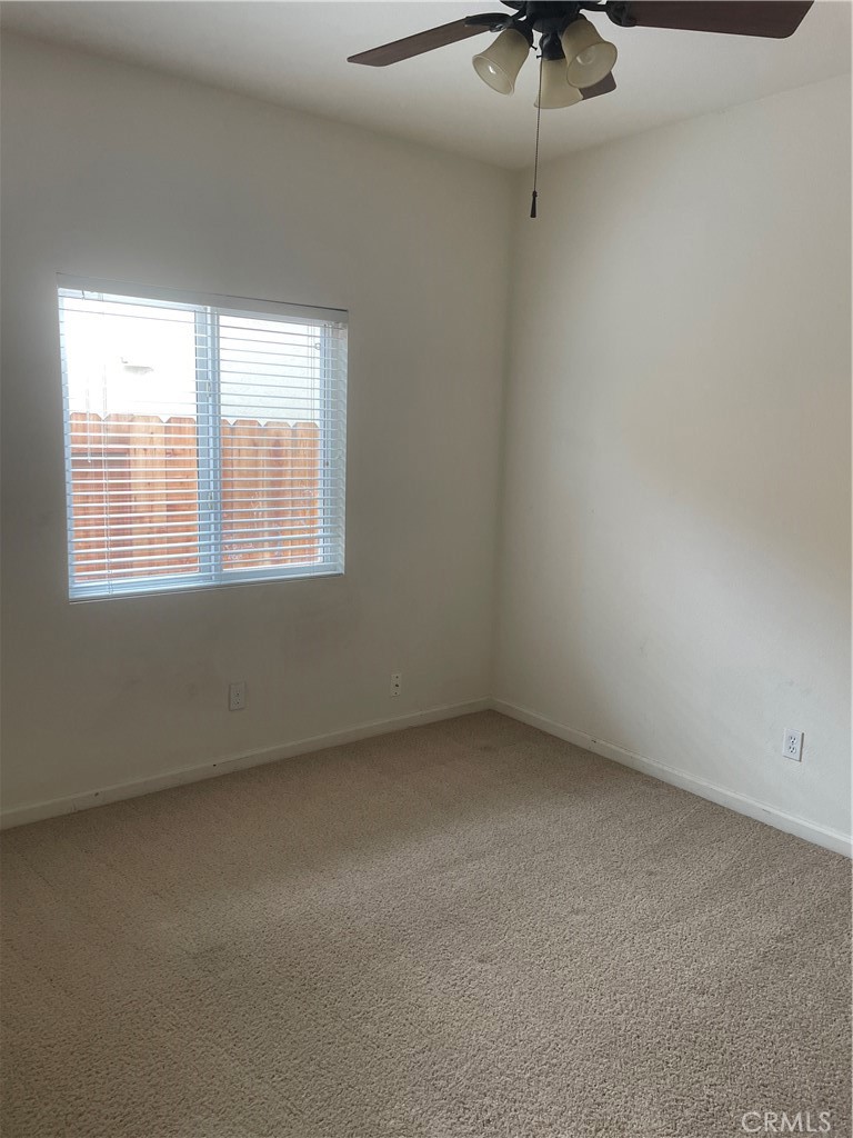 3583 Sarasota Avenue Merced, CA 95348 - Photo 14 of 23 an empty room with a window