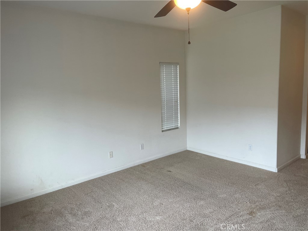 3583 Sarasota Avenue Merced, CA 95348 - Photo 21 of 23 an empty room with a fan