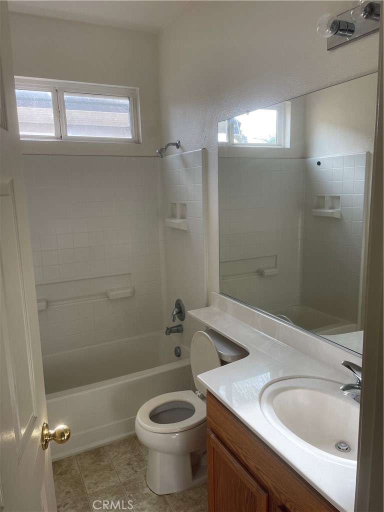 3583 Sarasota Avenue Merced, CA 95348 - Photo 10 of 23 a bathroom with a sink a toilet and shower