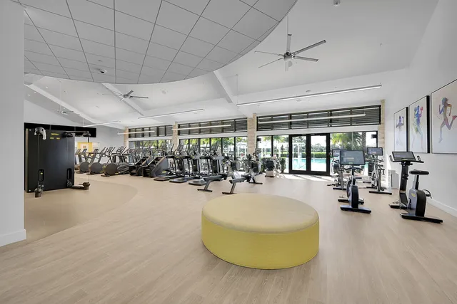 a room with gym equipment and a large window