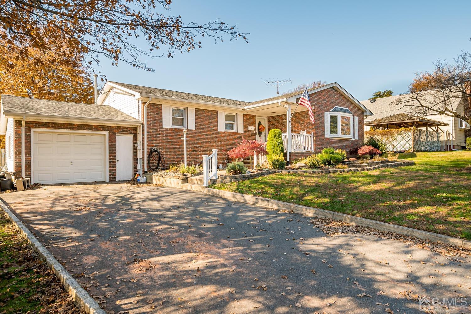50 Old Post Road Edison, NJ 08817 - Photo 2 of 39 a front view of a house with a yard
