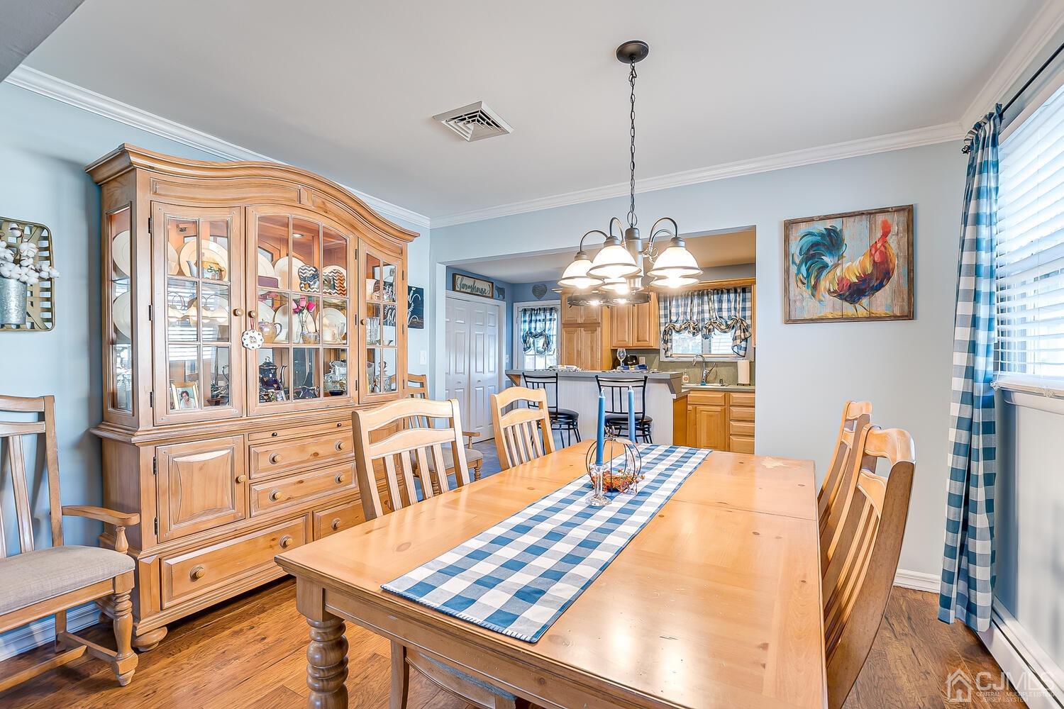50 Old Post Road Edison, NJ 08817 - Photo 12 of 39 a dining room with furniture a chandelier and wooden floor