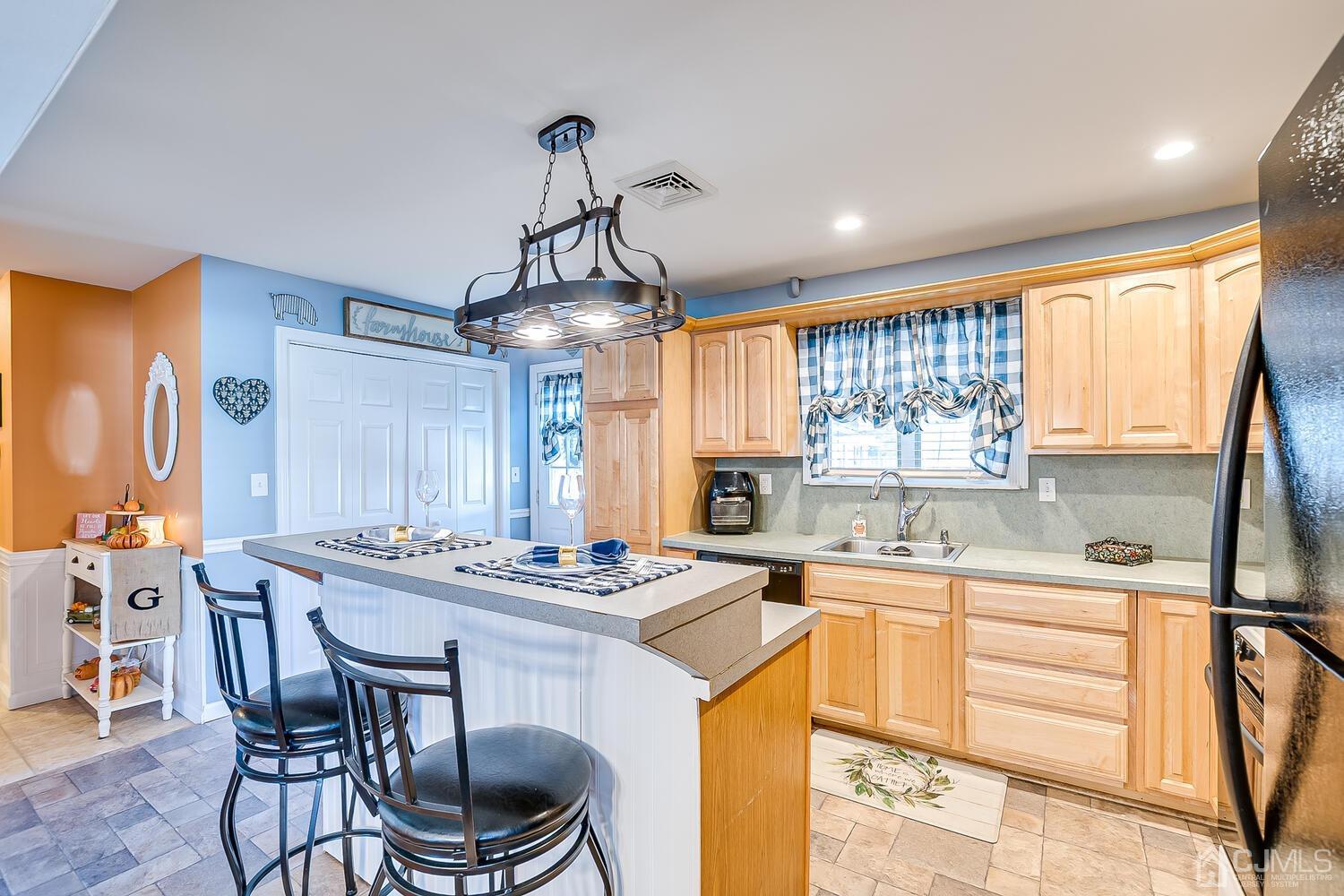 50 Old Post Road Edison, NJ 08817 - Photo 15 of 39 a kitchen that has a table chairs a sink and cabinets