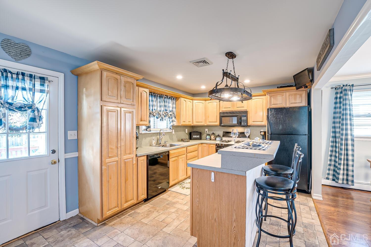 50 Old Post Road Edison, NJ 08817 - Photo 16 of 39 a kitchen with refrigerator and cabinets
