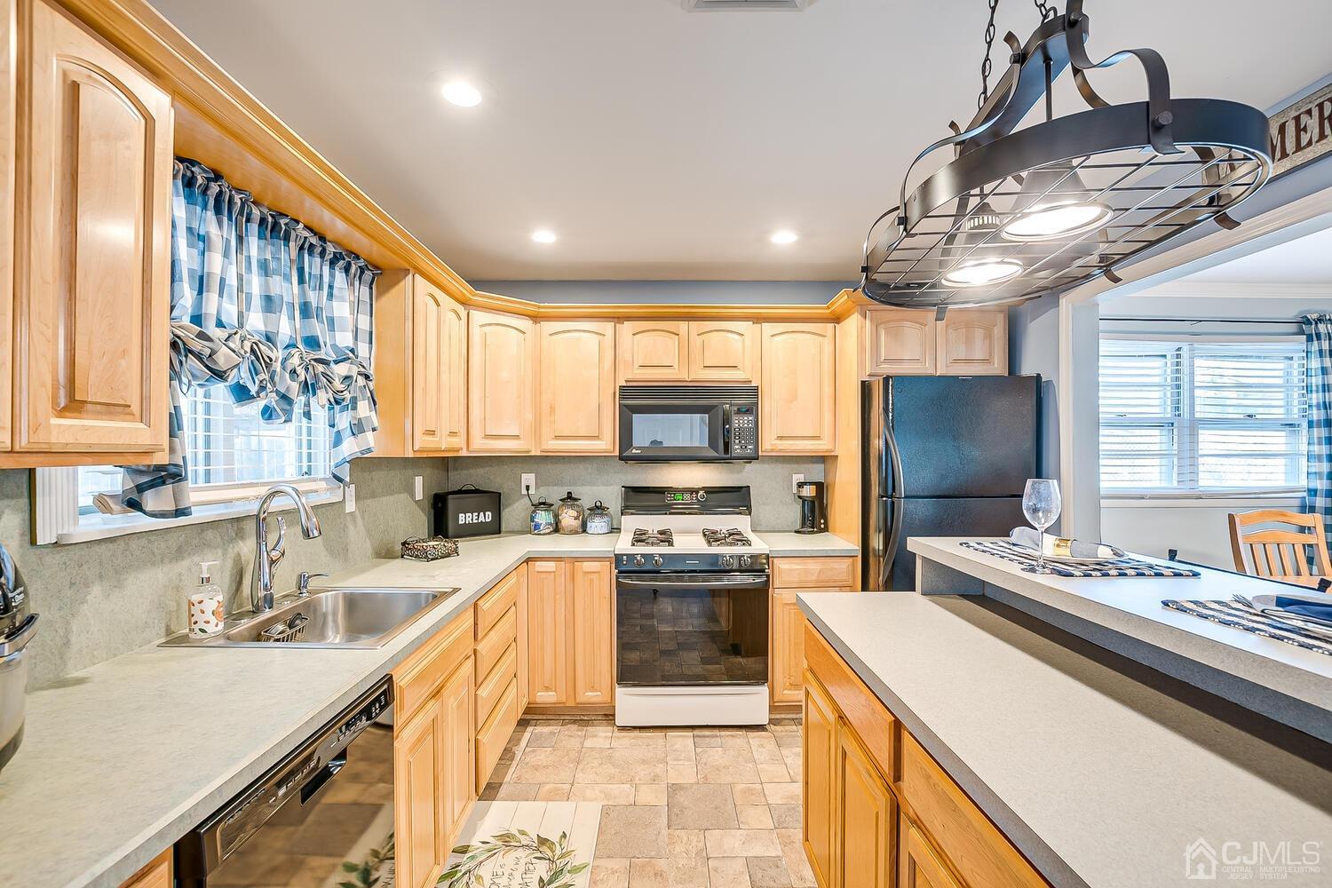 50 Old Post Road Edison, NJ 08817 - Photo 18 of 39 a kitchen with a sink appliances and cabinets