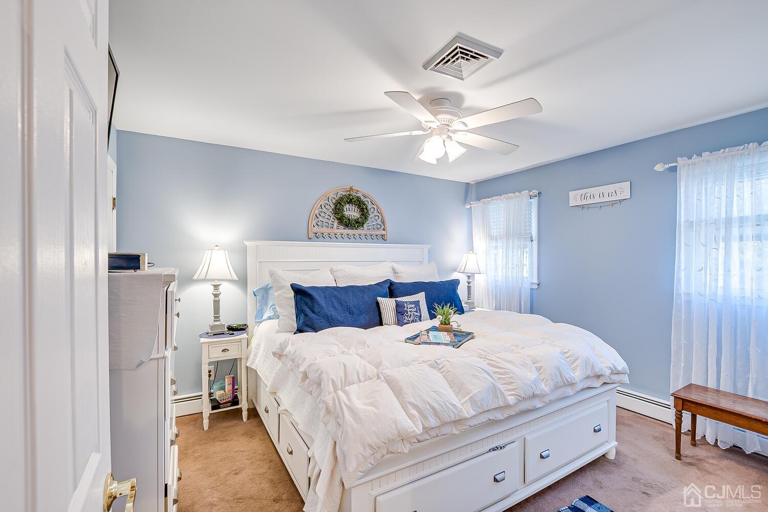50 Old Post Road Edison, NJ 08817 - Photo 21 of 39 a bedroom with a bed and a chandelier