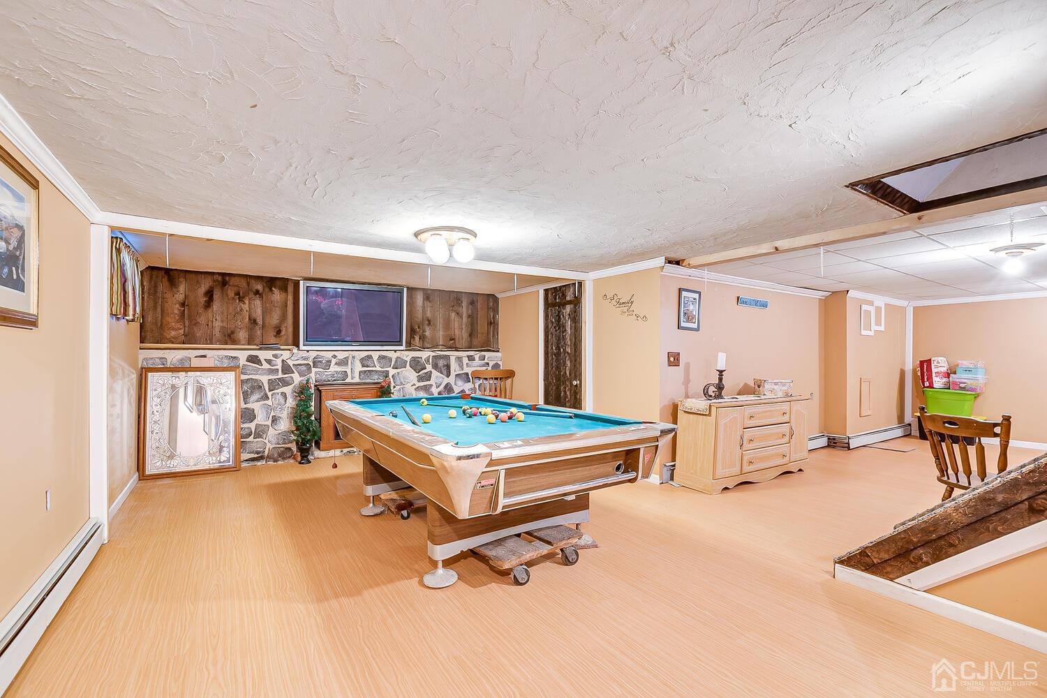 50 Old Post Road Edison, NJ 08817 - Photo 27 of 39 a living room with furniture pool table and a large window
