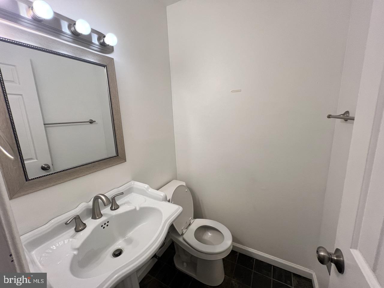 3502 Old Jones Road Dunkirk, MD 20754 - Photo 16 of 61 a bathroom with a sink and a mirror