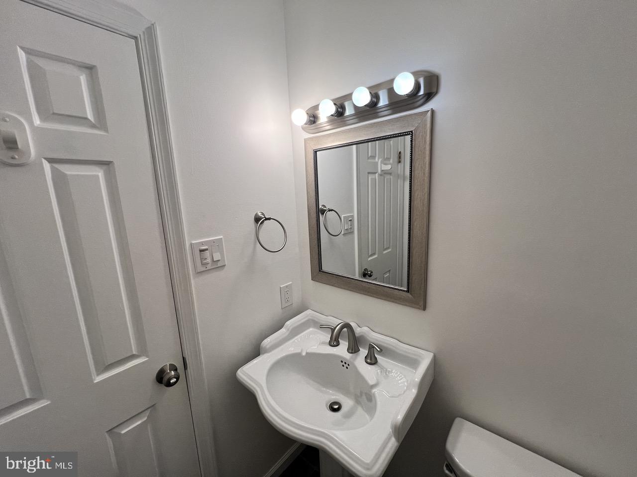 3502 Old Jones Road Dunkirk, MD 20754 - Photo 17 of 61 a bathroom with a sink a mirror and vanity
