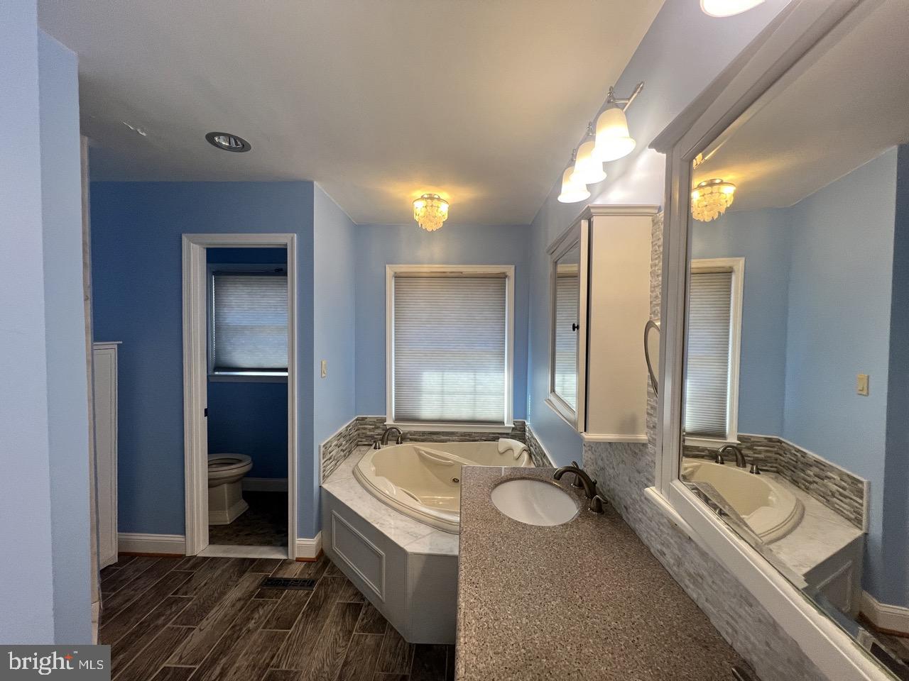 3502 Old Jones Road Dunkirk, MD 20754 - Photo 22 of 61 a bathroom with a granite countertop sink and a mirror