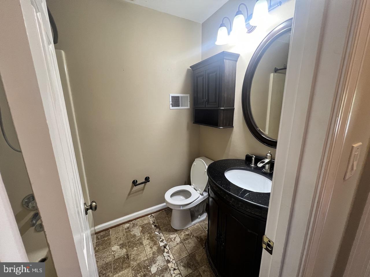 3502 Old Jones Road Dunkirk, MD 20754 - Photo 30 of 61 a bathroom with a toilet sink and mirror