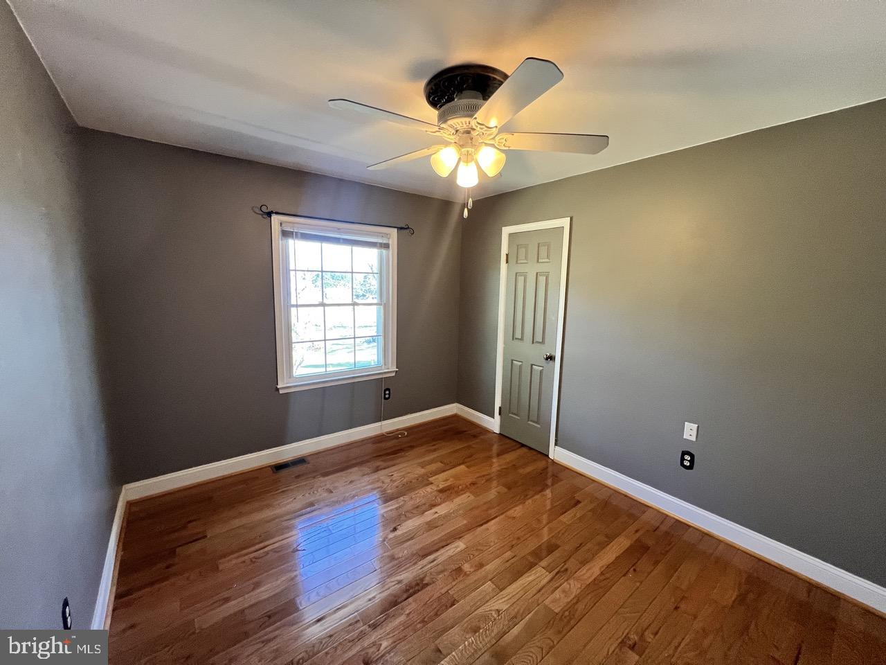 3502 Old Jones Road Dunkirk, MD 20754 - Photo 34 of 61 a view of an empty room with window and chandelier fan