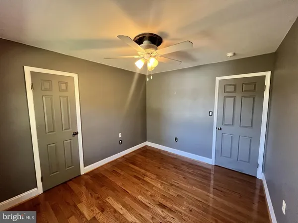 a view of an empty room with windows