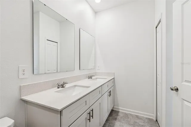 a kitchen with stainless steel appliances granite countertop a sink a stove a microwave and refrigerator