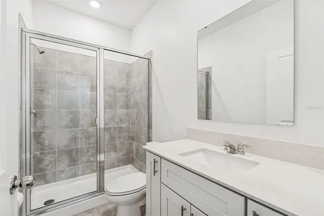 a view of a lake with a table and chairs