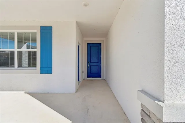 a view of hallway with windows