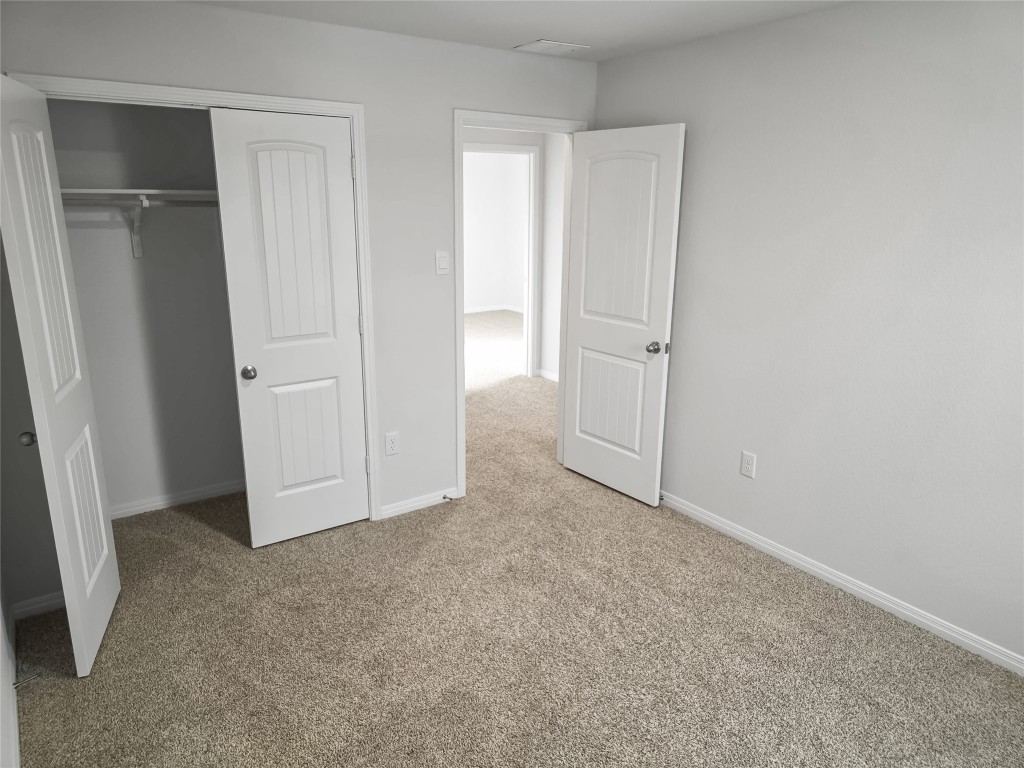 410 Inks Lane Kyle, TX 78640 - Photo 13 of 20 Unfurnished bedroom with carpet flooring and a closet