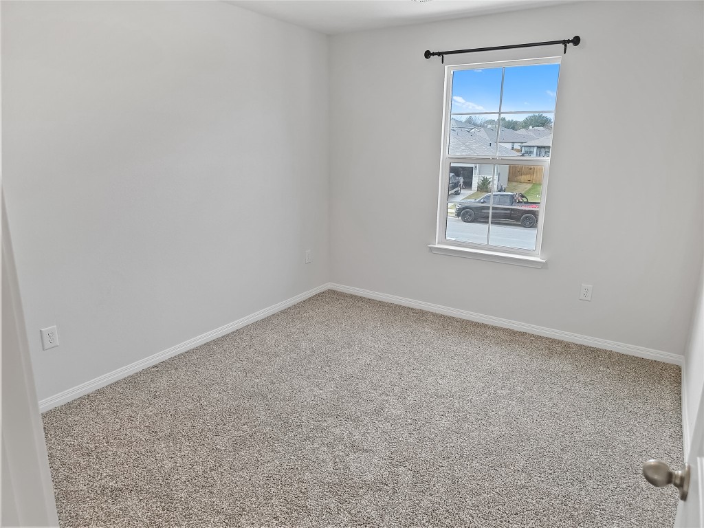 410 Inks Lane Kyle, TX 78640 - Photo 15 of 20 Spare room featuring carpet flooring and baseboards
