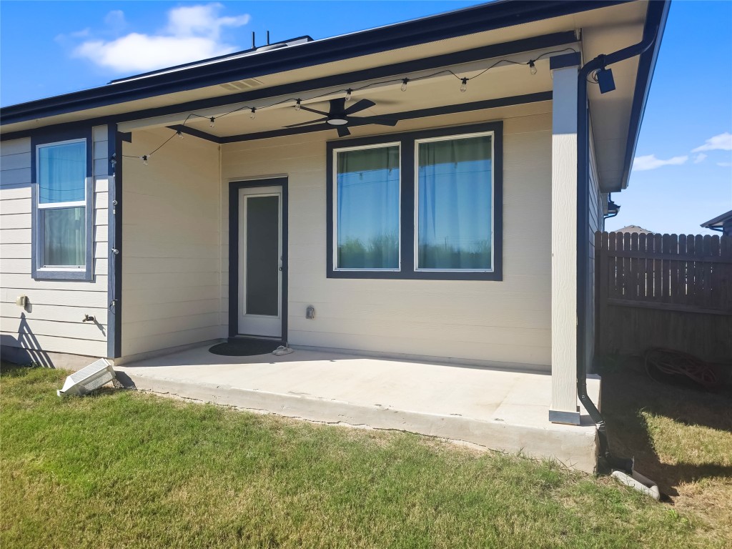 410 Inks Lane Kyle, TX 78640 - Photo 4 of 20 Rear view of house with a patio area and a ceiling fan