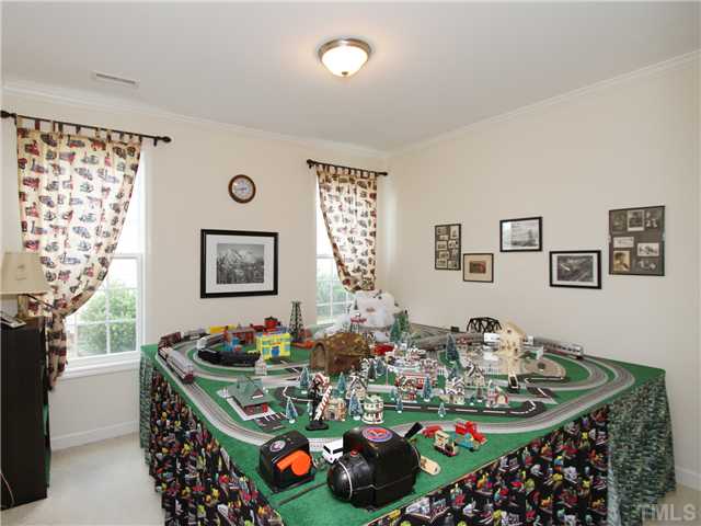 5228 Holly Ridge Farm Road Raleigh, NC 27616 - Photo 17 of 25 FIRST FLOOR BEDROOM OF OFFICE - HOUSING THE HOMEOWNERS MODEL TRAIN SET!