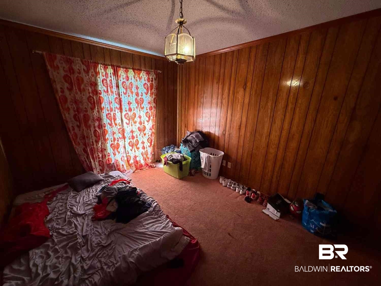 3721 Robertson Court Mobile, AL 36693 - Photo 18 of 22 Carpeted bedroom featuring a textured ceiling and wood walls