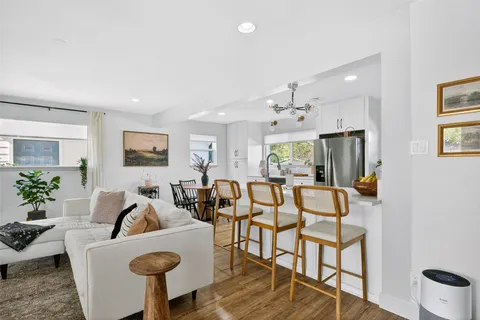 a view of a house with backyard porch and sitting area