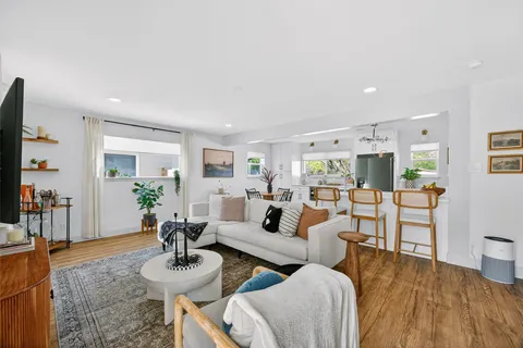 a view of a chair and table in backyard